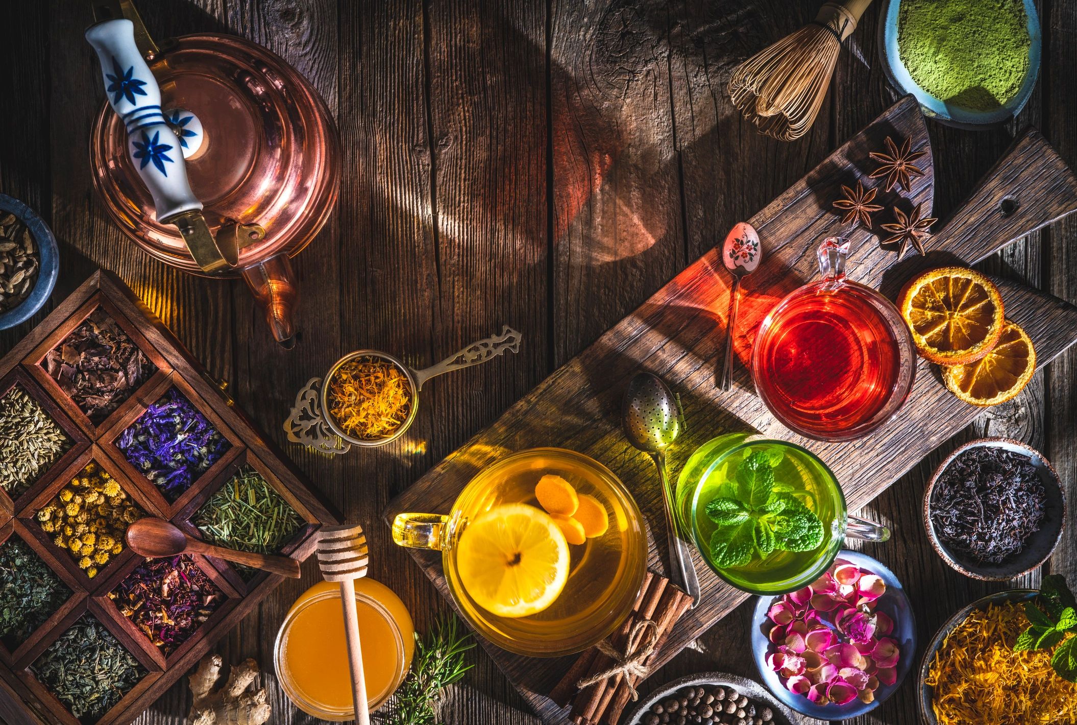 Tea and herbal infusion with dried herbs on wooden rustic table board